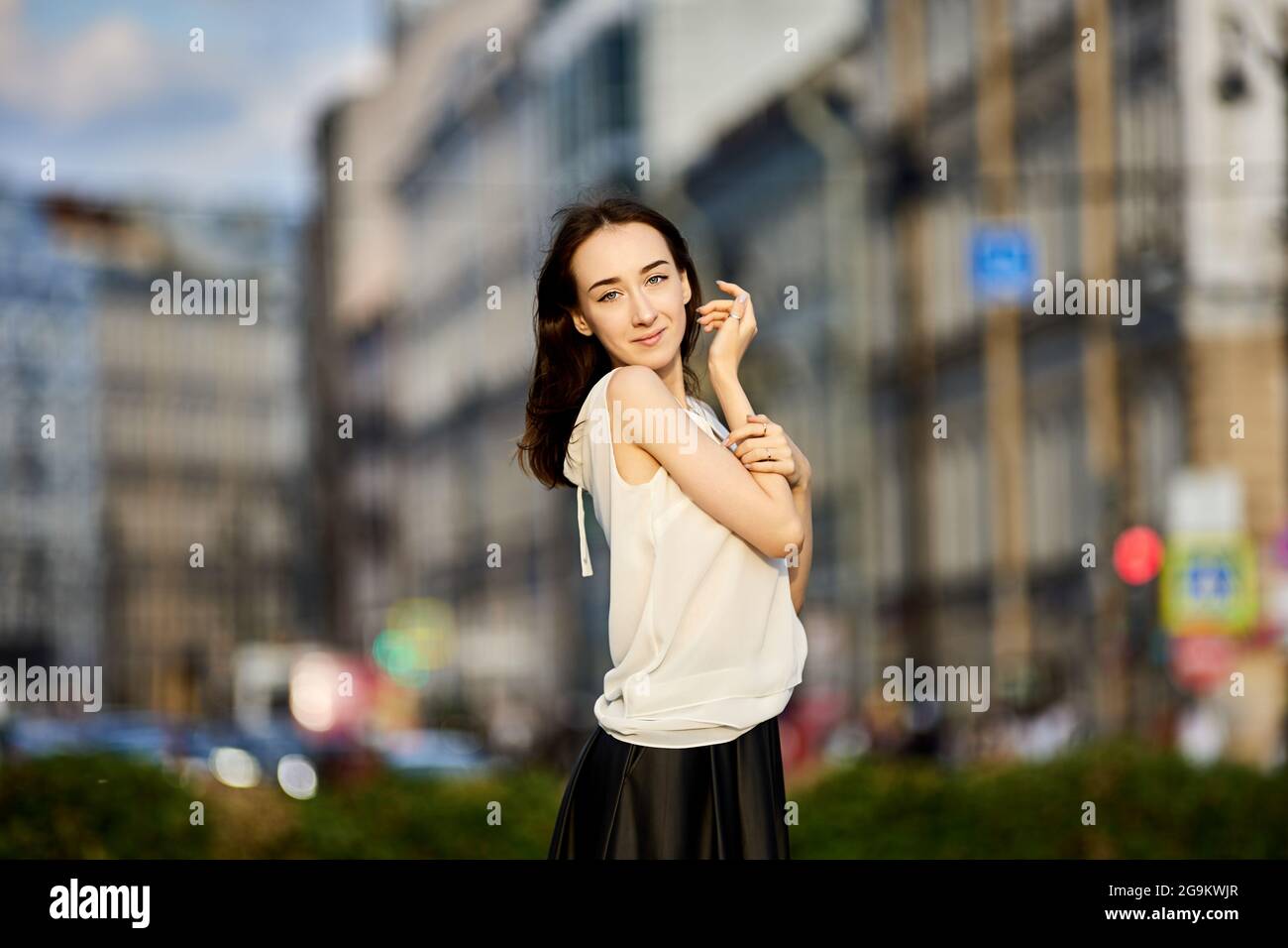Slim young woman 18 years old stands on city street Stock Photo - Alamy