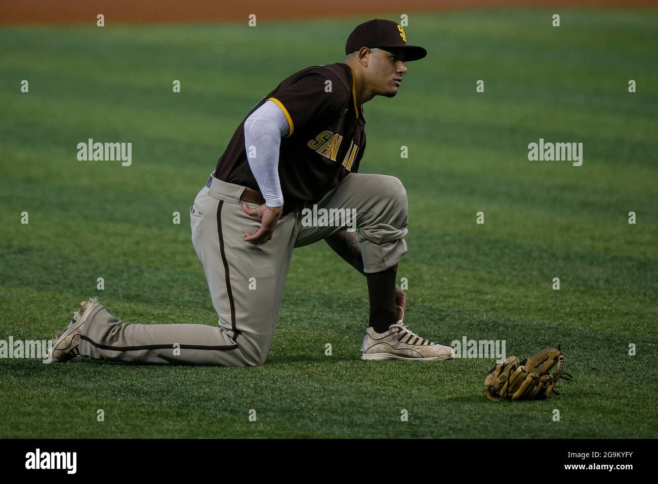 San Diego Padres third basemen Manny Machado (13) ties his shoes in protest  over a call made by MLB home plate umpire Bill Miller during an MLB regula  Stock Photo - Alamy