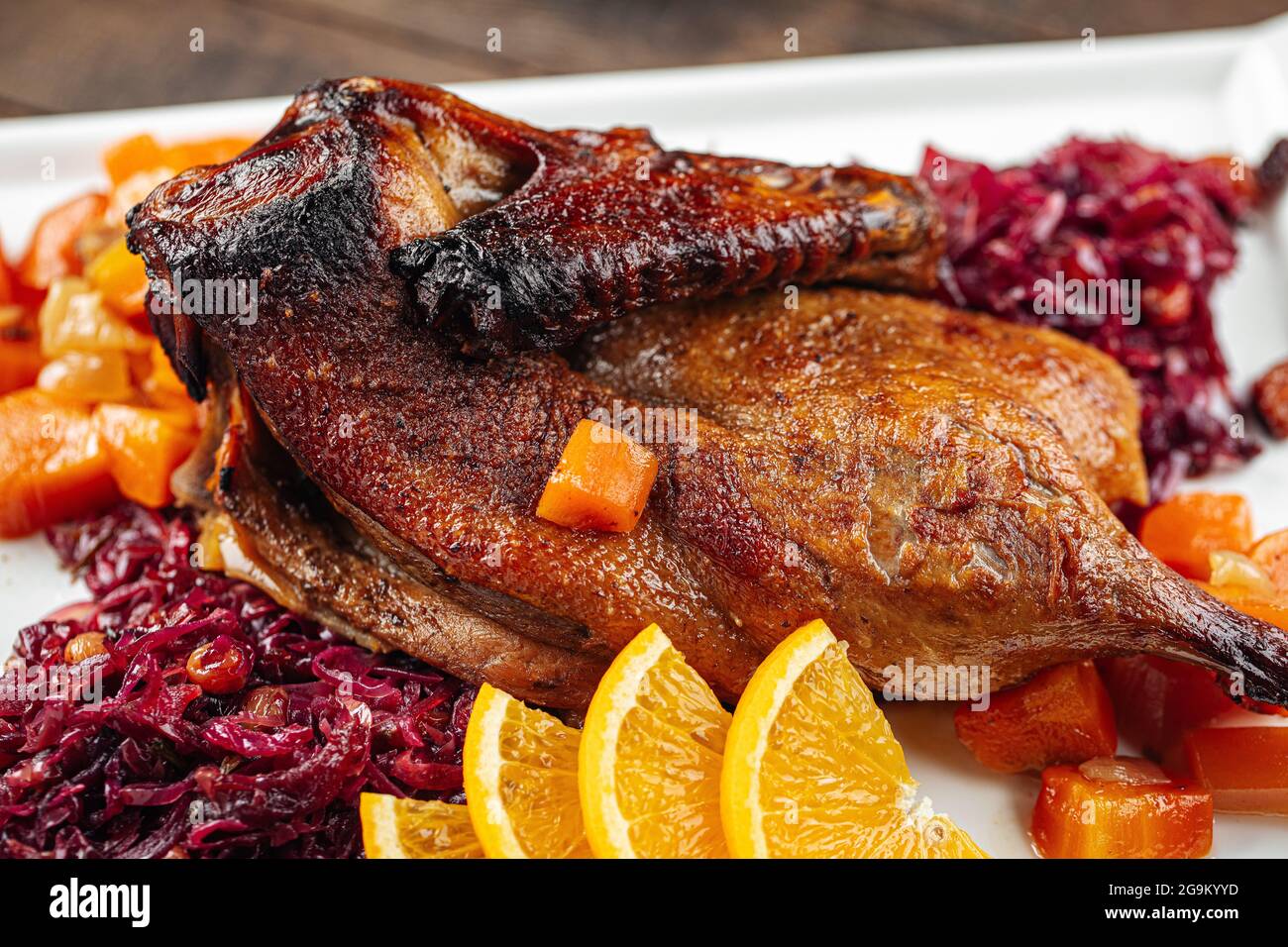 Dish of roast peking duck with different salads Stock Photo Alamy