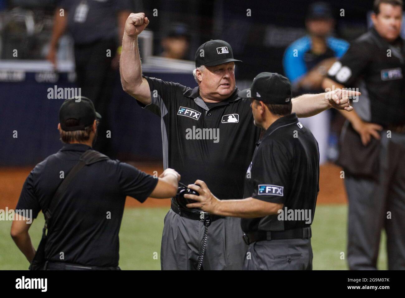 MLB second base umpire Brian Knight calls an out for interference ending an MLB regular season game between the San Diego Padres and Miami Marlins, Sa Stock Photo