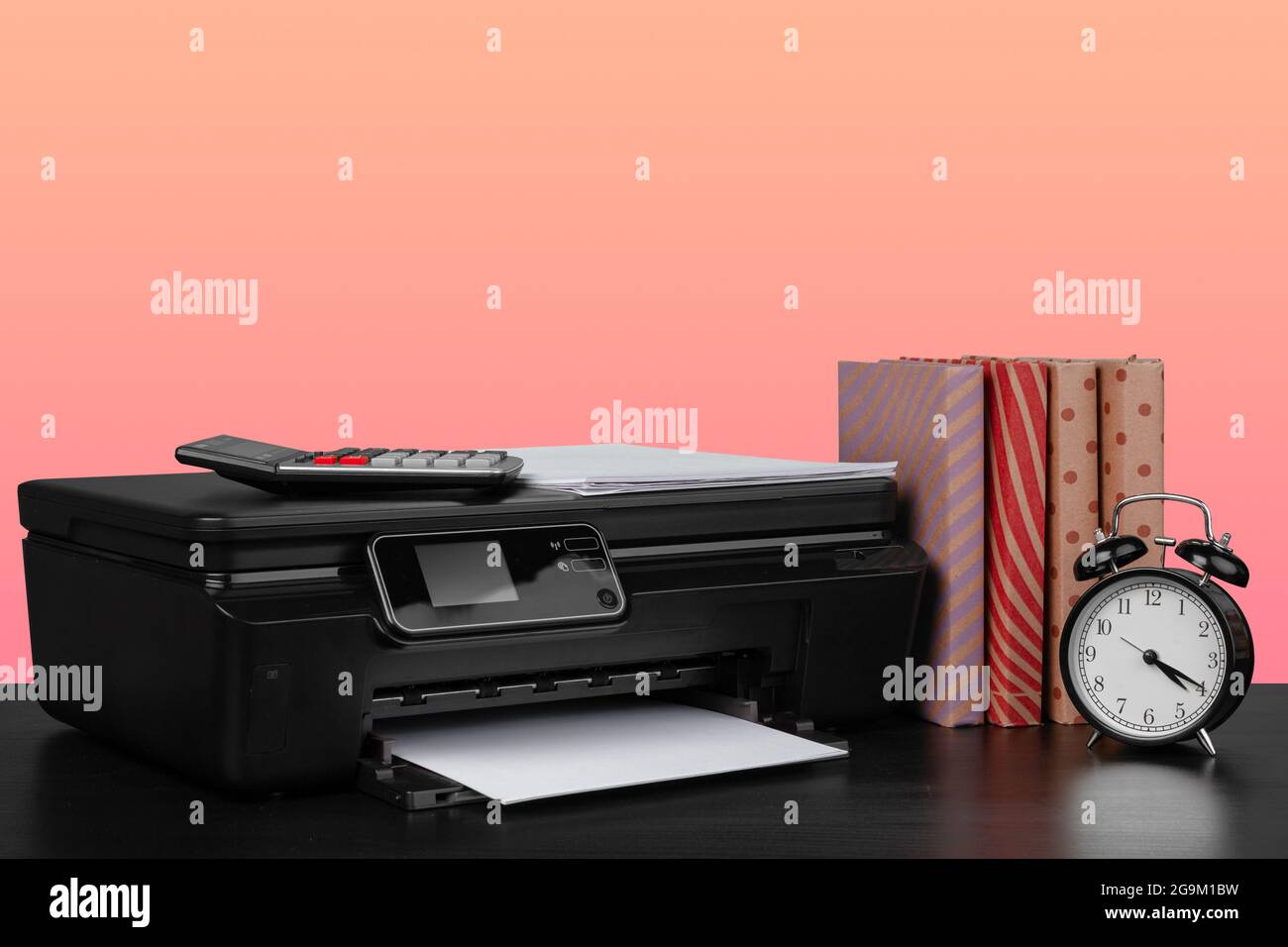 Compact home laser printer against pink background Stock Photo
