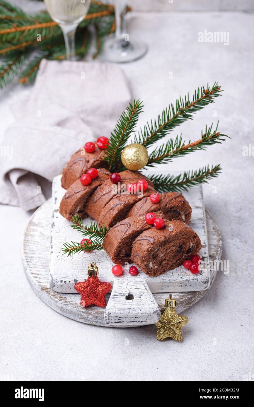 Christmas chocolate roll cake with cream Stock Photo
