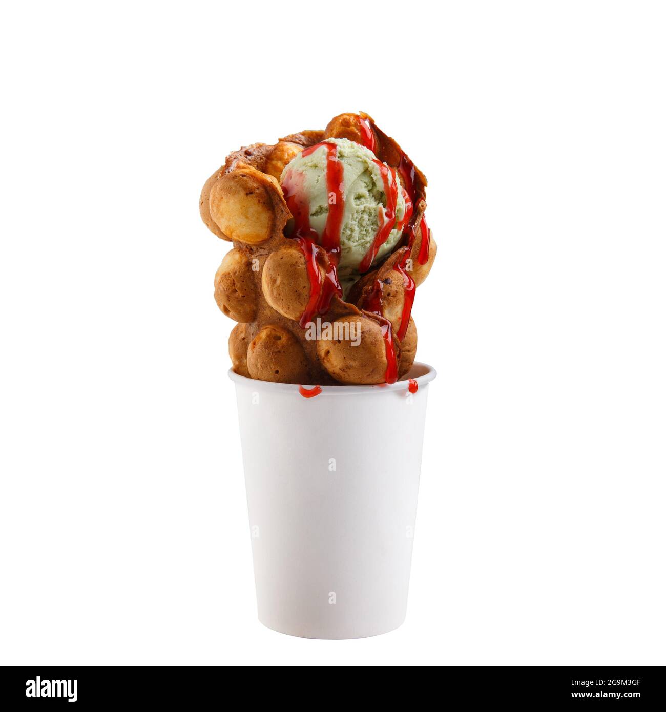 Hong Kong waffles with pistachio ice cream in paper cup isolated on