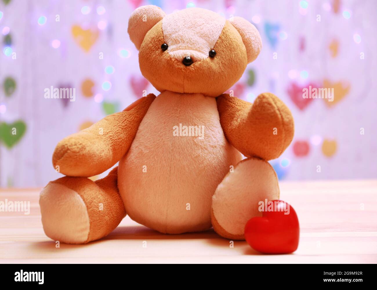 Teddy Bear With Red Heart On Festive Background Stock Photo Alamy