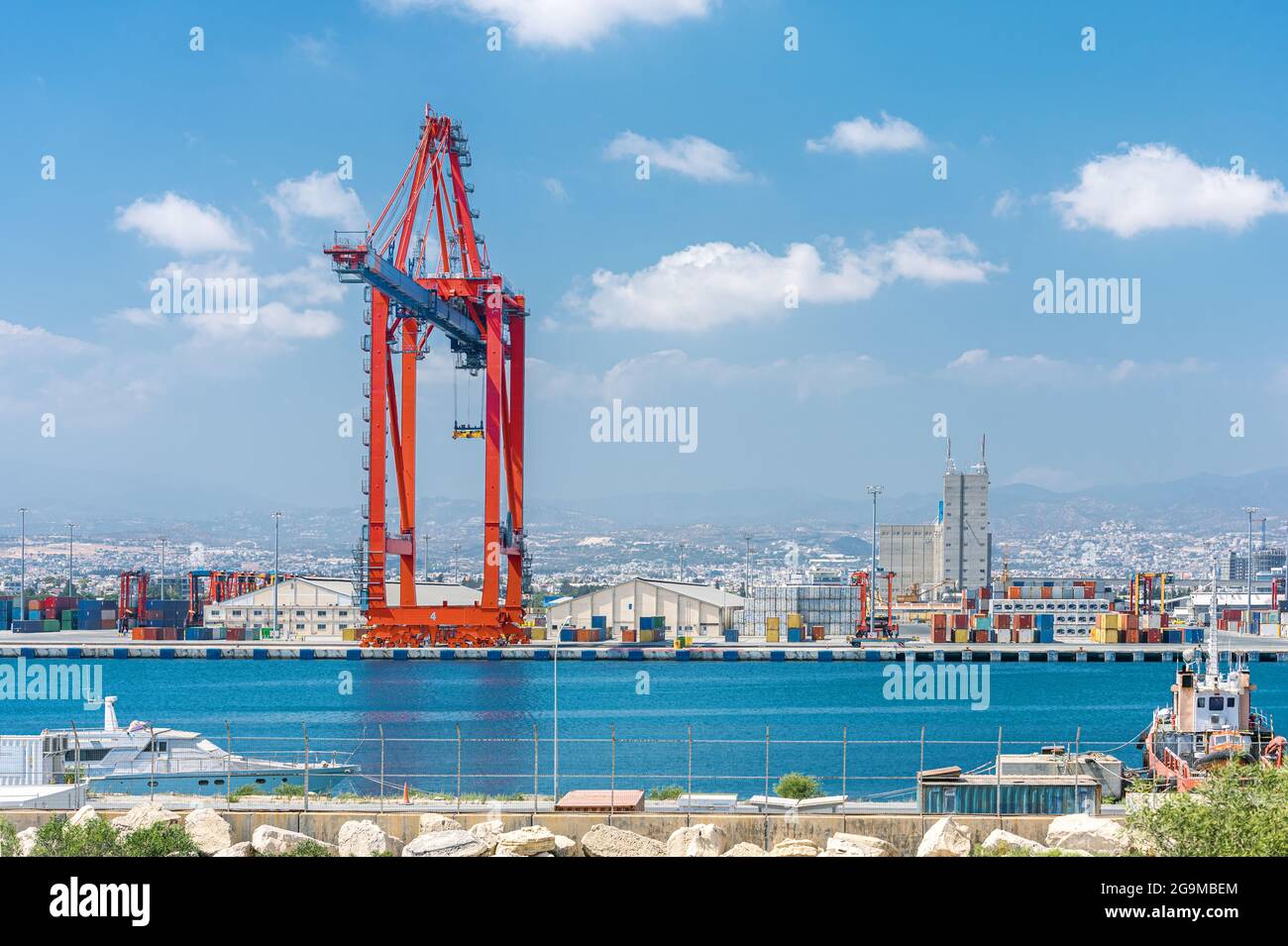 Ship to shore gantry crane and container warehouse in Limassol cargo port, Cyprus Stock Photo