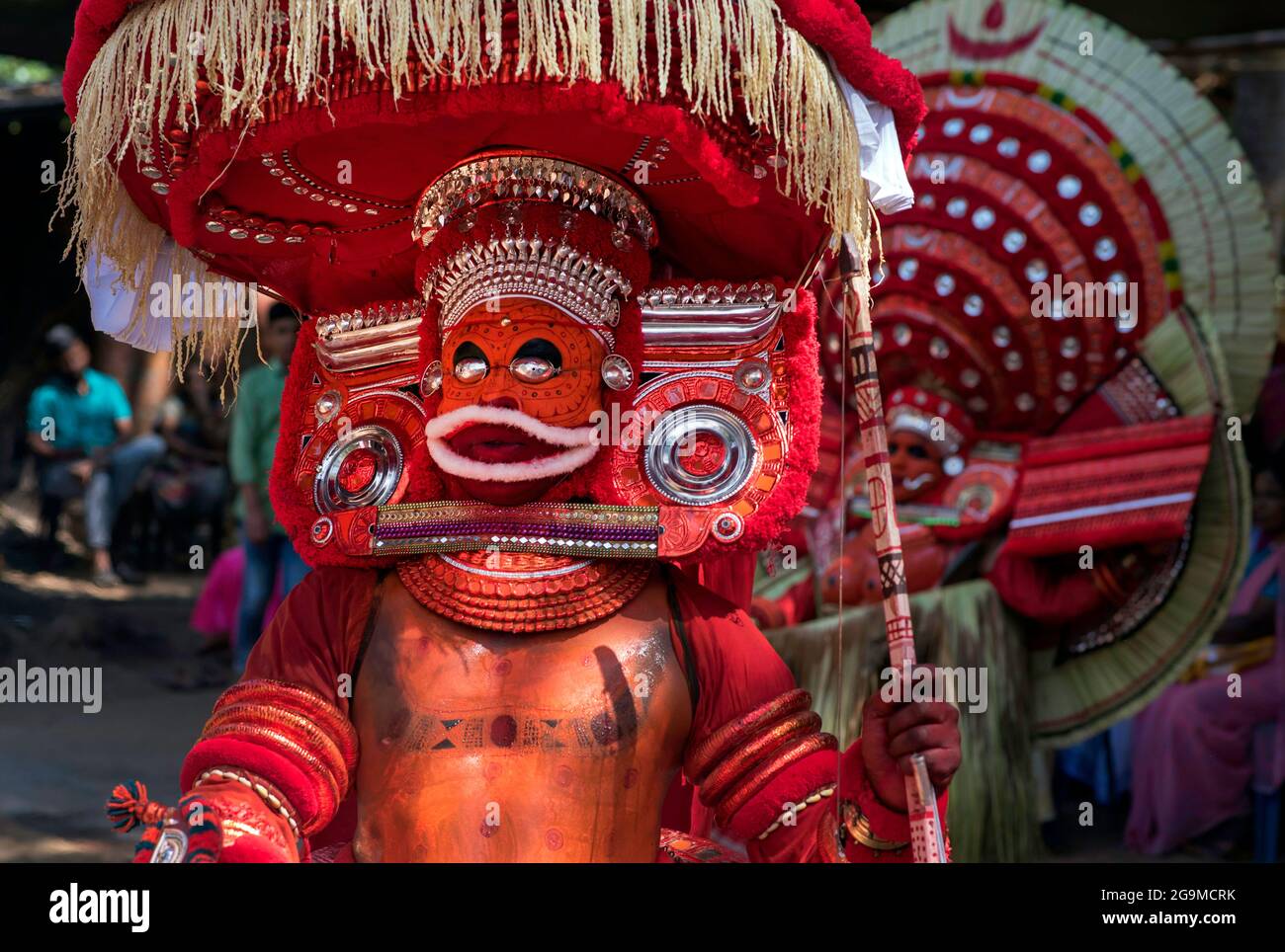 Theyyam (Teyyam, Theyam, Theyyattam) is a popular ritual form of dance worship in Kerala and Karnataka, India. Theyyam consisted of several thousand-y Stock Photo