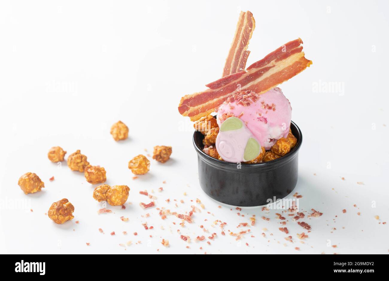 EDITORIAL USE ONLY The 'Don’t be Disgruntled' flavour, featuring Percy Pig ice cream with crunchy bacon bits and a Percy Pig sweet from Ocado's 'A Serving Just for You' menu of 10 new flavours created by Gastro-physicist, Jozef Youssef, which have been scientifically designed to match different moods and occasions. Issue date: Tuesday July 27, 2021. Stock Photo