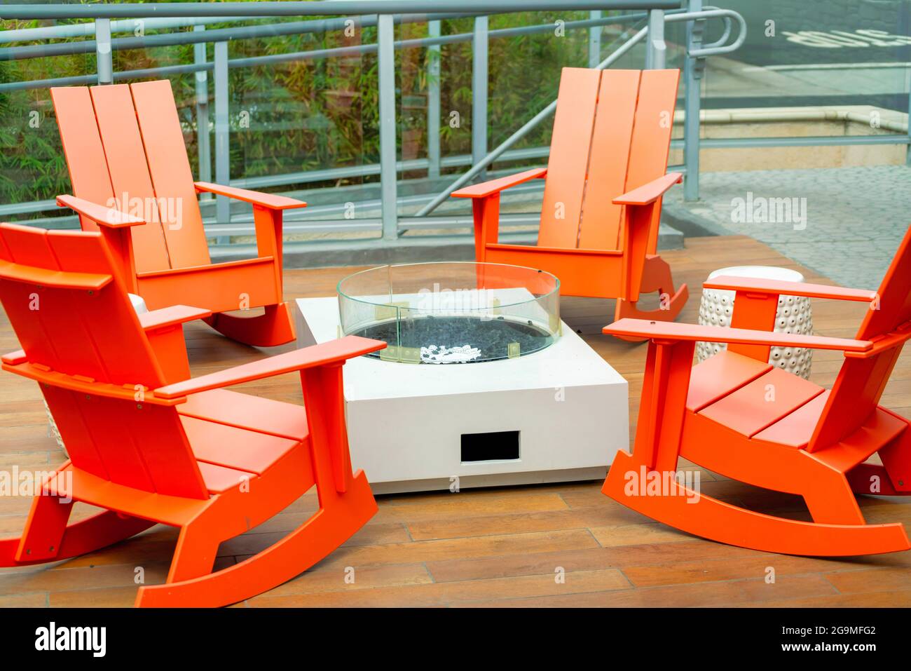 Orange patio chairs on the pool side Stock Photo - Alamy
