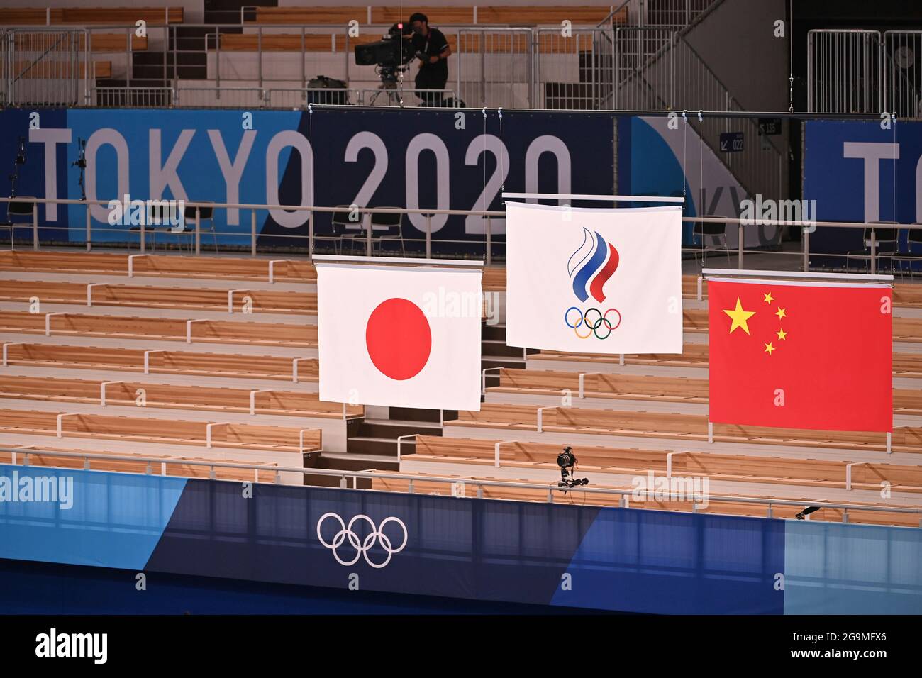 Tokyo, Japan. 26th July, 2021. Award ceremony, the flags of the medalists, from left Japan (JPN), Russian Olympic Comwithtee (ROC), China (CHN) apparatus gymnastics, gymnastics, all around the men, artistic gymnastics, menÕs team, Ariake Gymnastics Center, Olympic Summer Games 2020, from 23.07. - 08.08.2021 in Tokyo/Japan. Credit: dpa/Alamy Live News Stock Photo