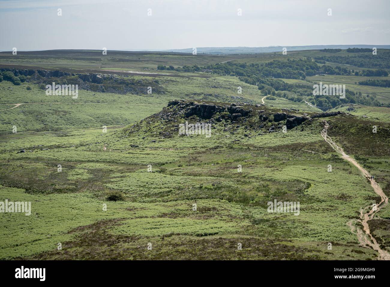 View of the ancient Iron Age hill fort Carl Wark from Higger Tor in the Peak District National Park, Derbyshire, UK. Stock Photo