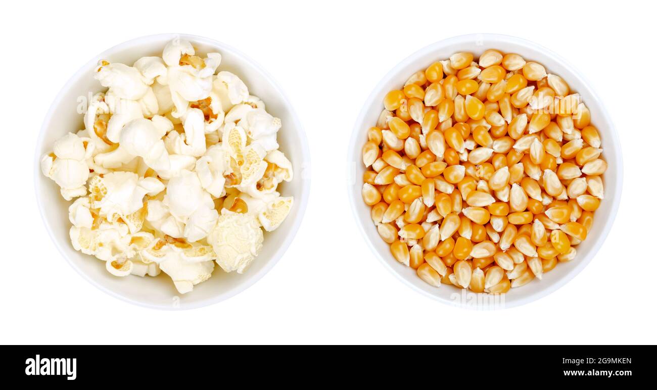 Popped and unpopped popcorn in white bowls. Butterfly shaped popcorn,  puffed up from heated kernels, and orange seeds of a special type of corn  Stock Photo - Alamy