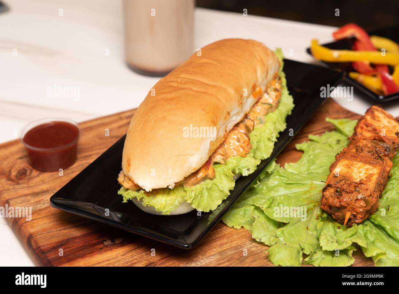 Long crispy chicken burger with mayonnaise Stock Photo Alamy