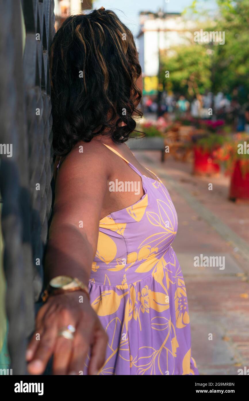 Portrait of a brunette woman in the street Stock Photo - Alamy