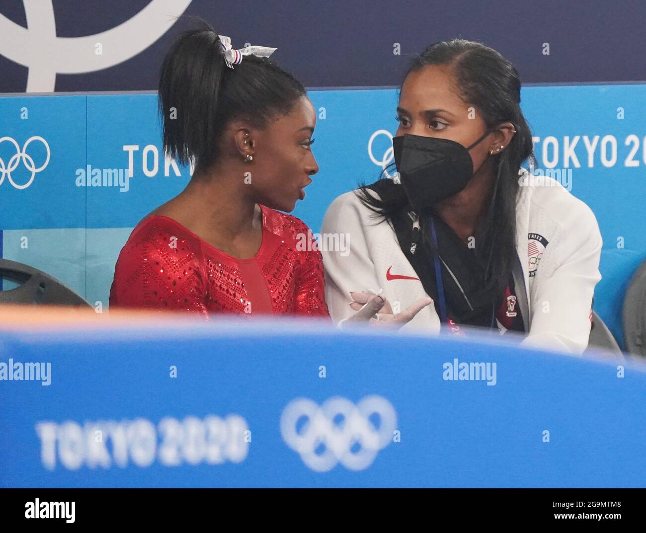 Tokyo, Japan. 27th July, 2021. Simone Biles talks to her coach after a