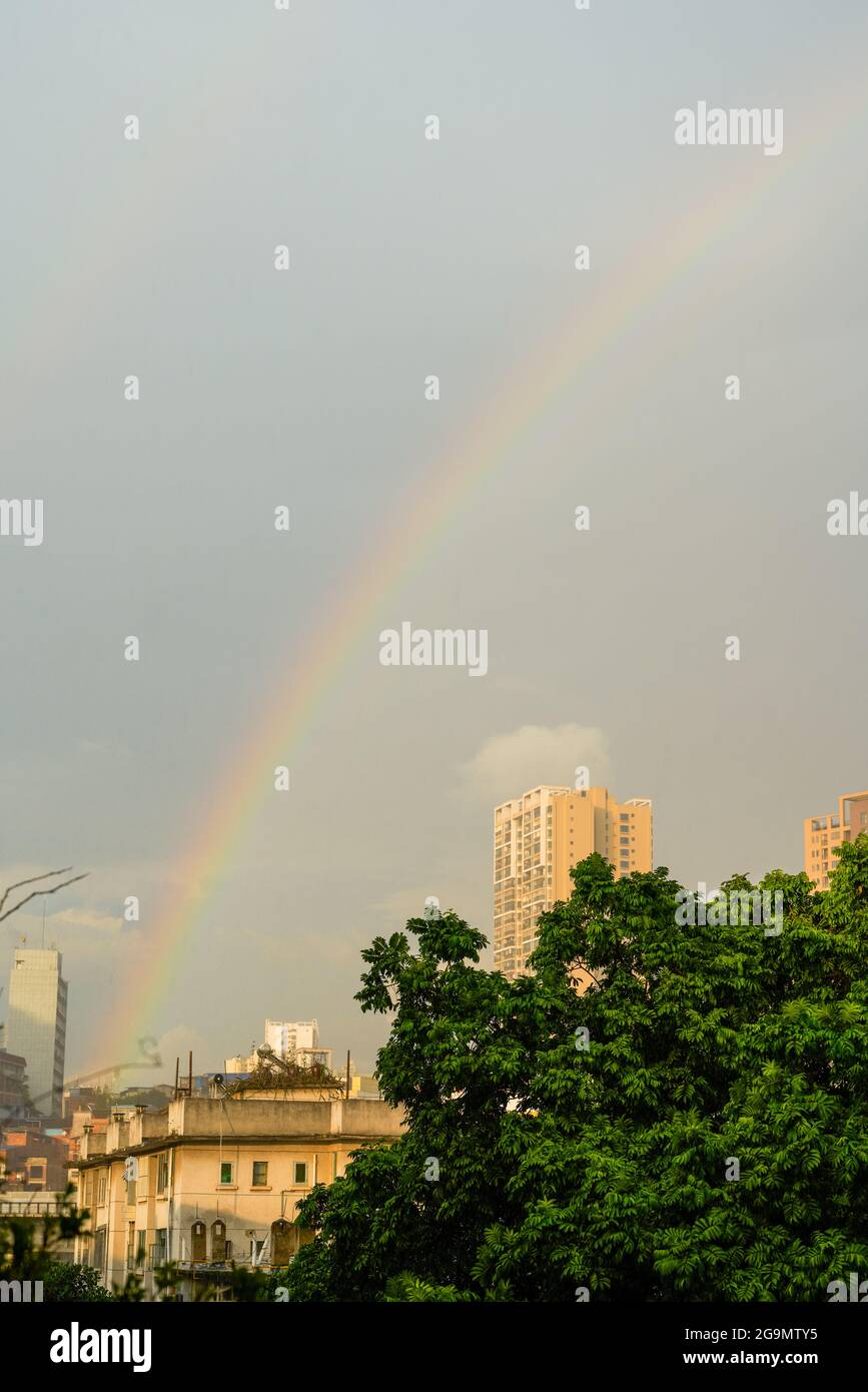 A double rainbow appeared over the city after the rain Stock Photo - Alamy
