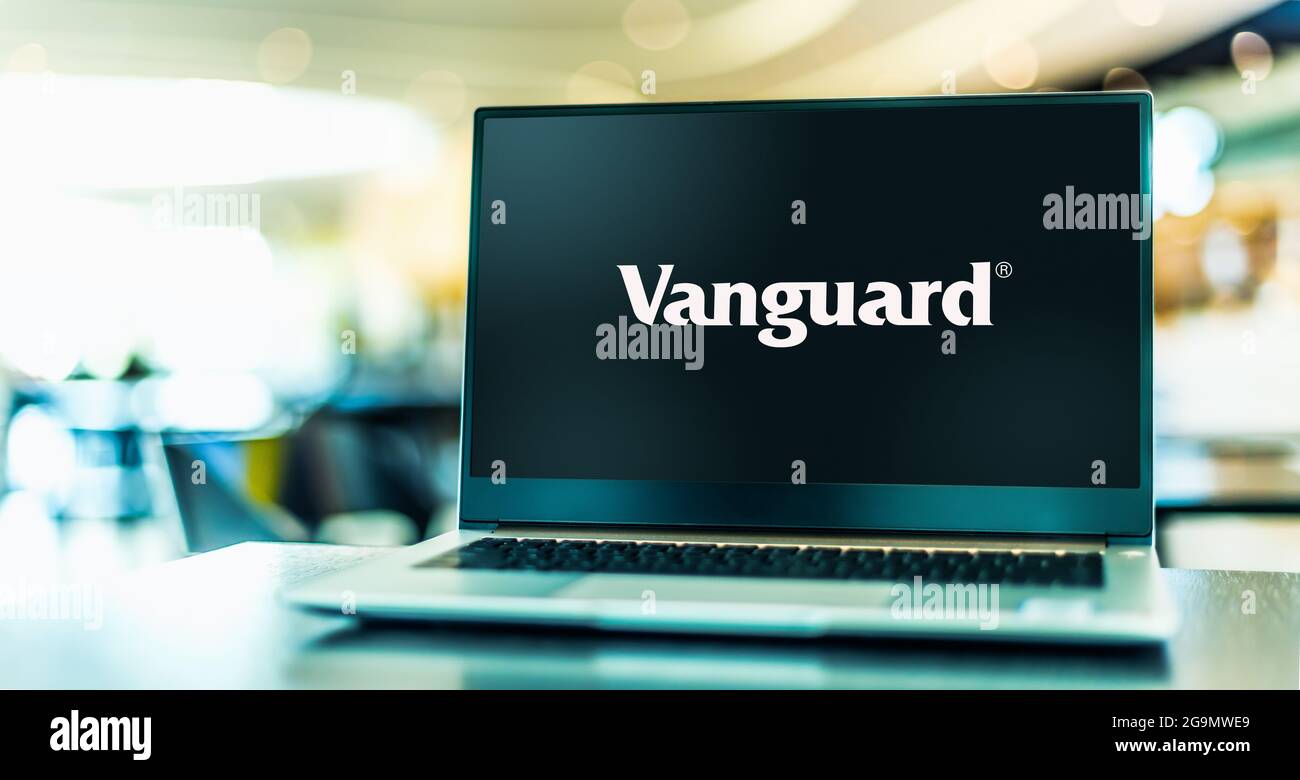 POZNAN, POL - JUL 3, 2021: Laptop computer displaying logo of The Vanguard Group, Inc., an American registered investment advisor based in Malvern, Pe Stock Photo