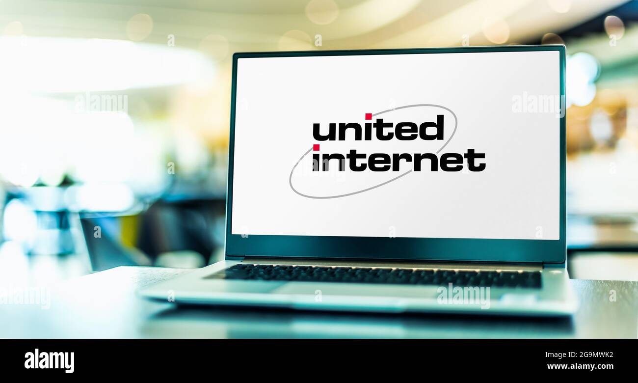 POZNAN, POL - JUL 10, 2021: Laptop computer displaying logo of United Internet, a global Internet services company headquartered in Montabaur, Rhinela Stock Photo