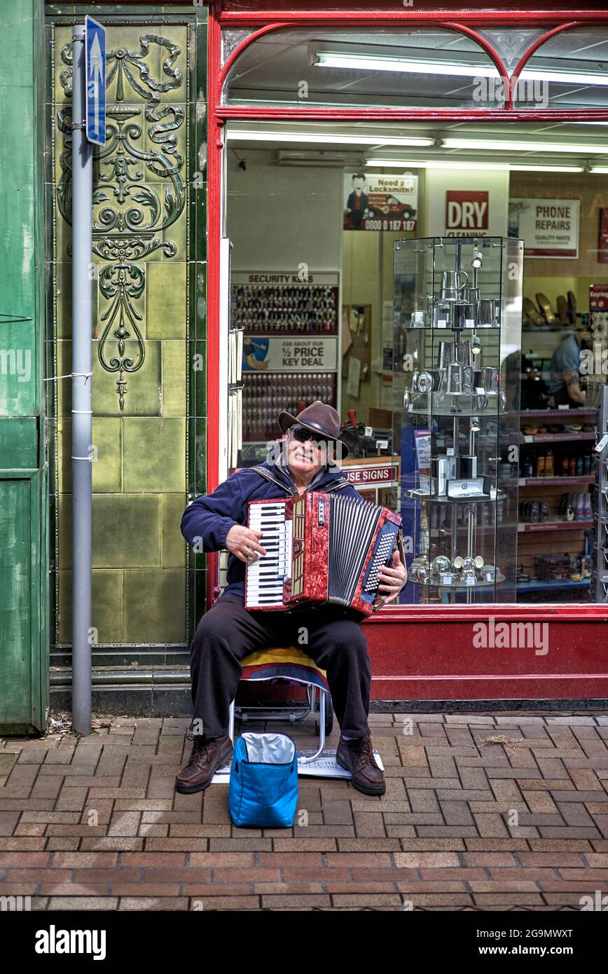 Busker, accordion, street, England, UK Stock Photo Alamy