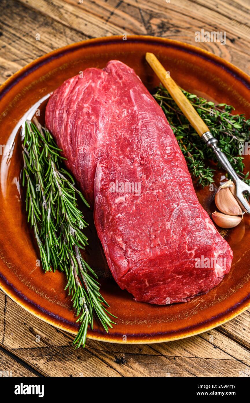 Whole Raw fillet Tenderloin beef veal meat for steaks. wooden