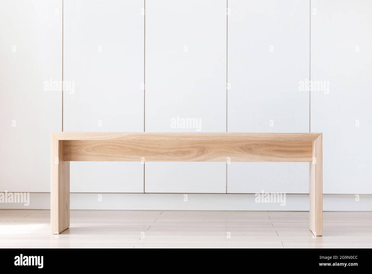 Minimal wooden bench, simple furniture Stock Photo