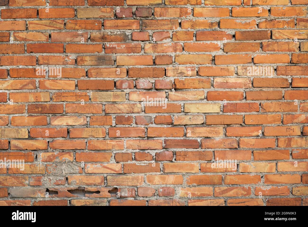 Wall made of red bricks as a background Stock Photo