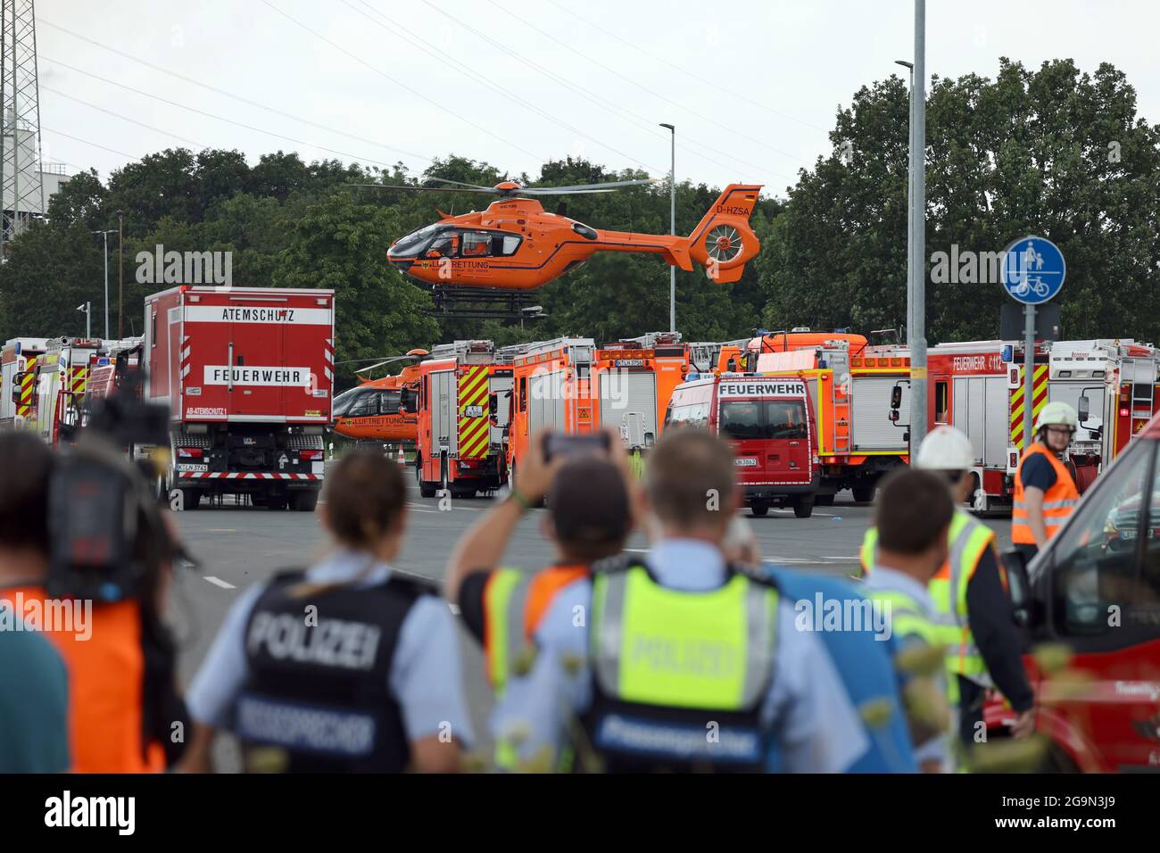 Leverkusen, Germany. 27th July, 2021. A rescue helicopter takes off near the Chempark. According to the Cologne police, several people were injured in an explosion at the Chempark Leverkusen this morning. As the operating company Currenta announced, five employees were still missing after the accident at the waste incineration plant. Credit: Oliver Berg/dpa/Alamy Live News Stock Photo