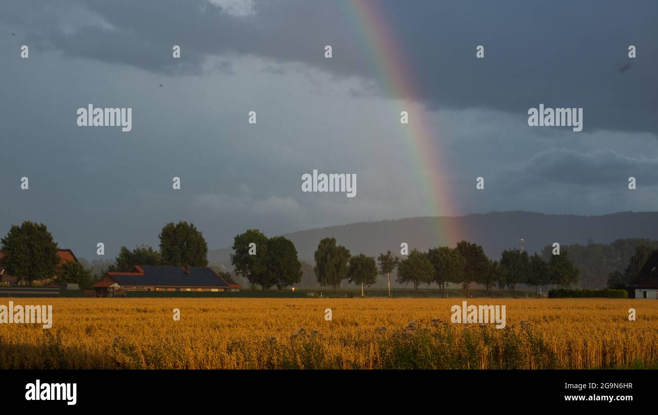 A rainbow with clouds Stock Photo - Alamy