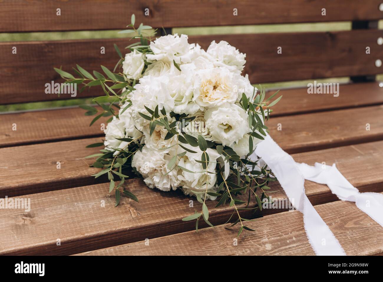 White bridal bouquet of peonies and roses. Scenery for the wedding ...