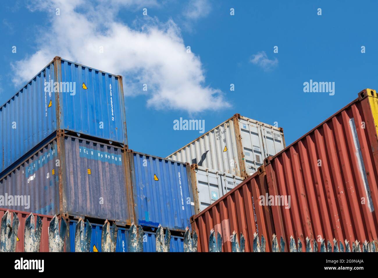 shipping containers stacked at a storage facility at the docks in