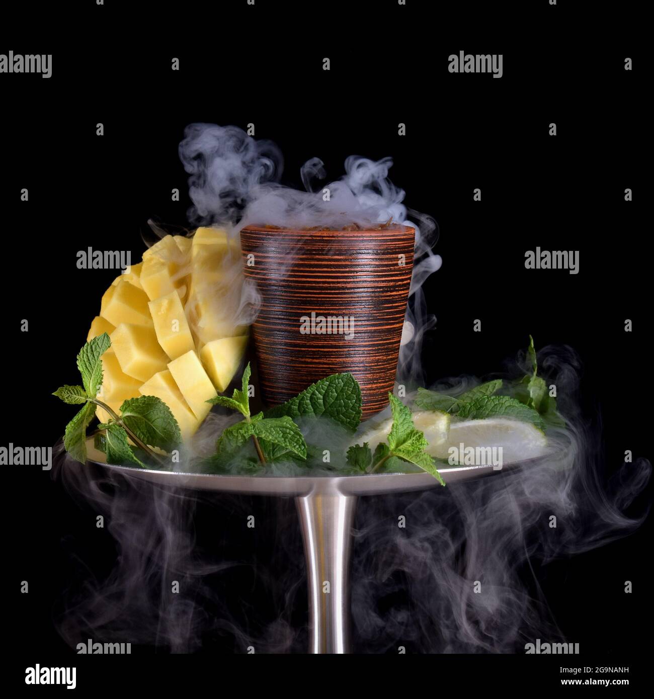 hookah bowl with tobacco on an black background Stock Photo
