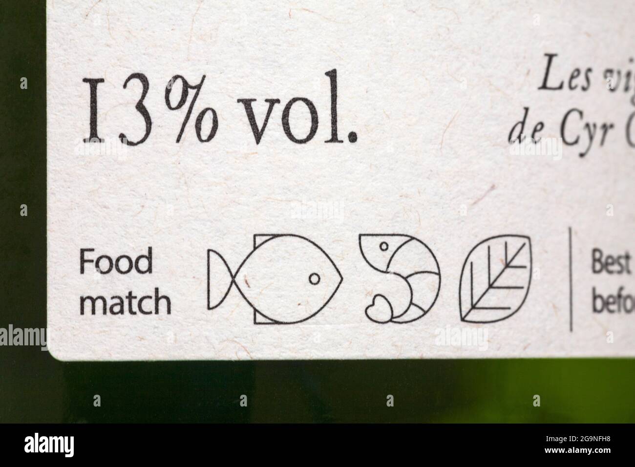 Food match symbols and 13% vol - detail on bottle of wine to match wine with food - alcohol by volume, alcohol content, strength Stock Photo