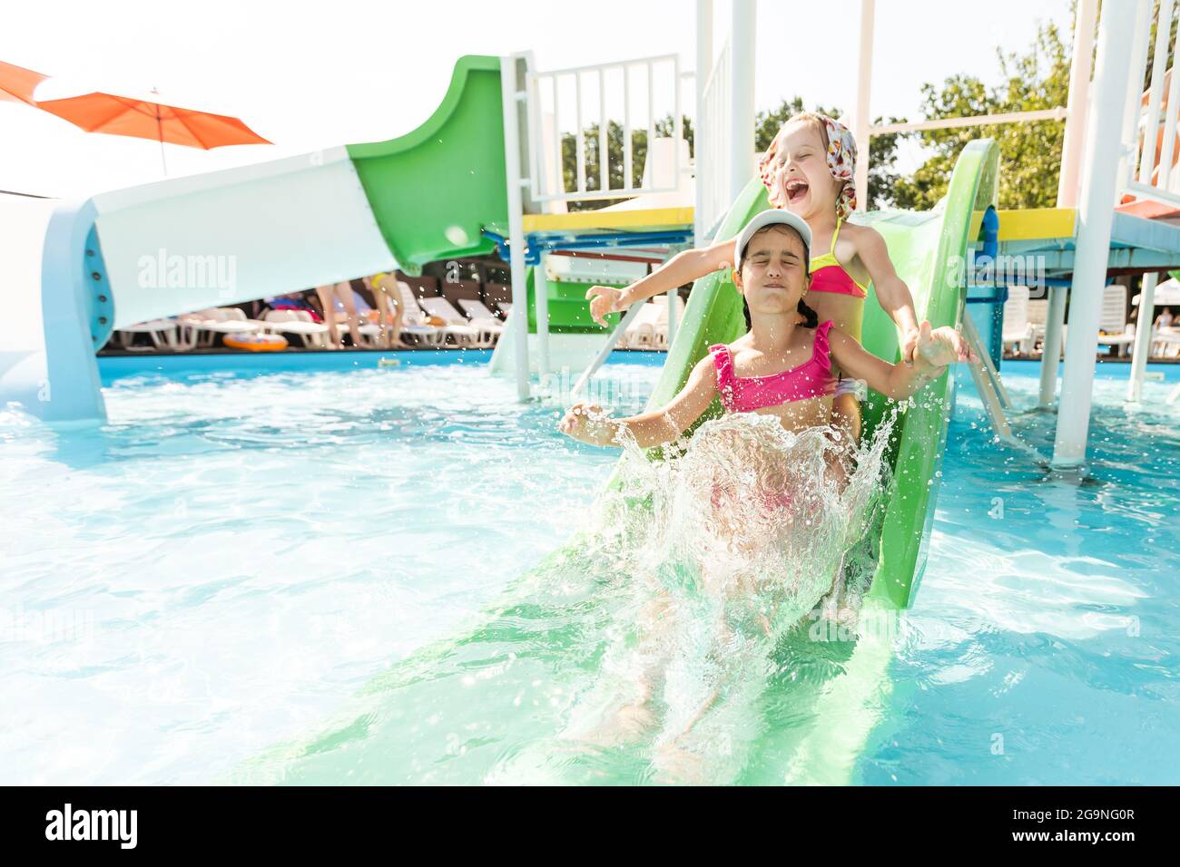 Happy child playing in swimming pool. Summer vacation concept Stock Photo