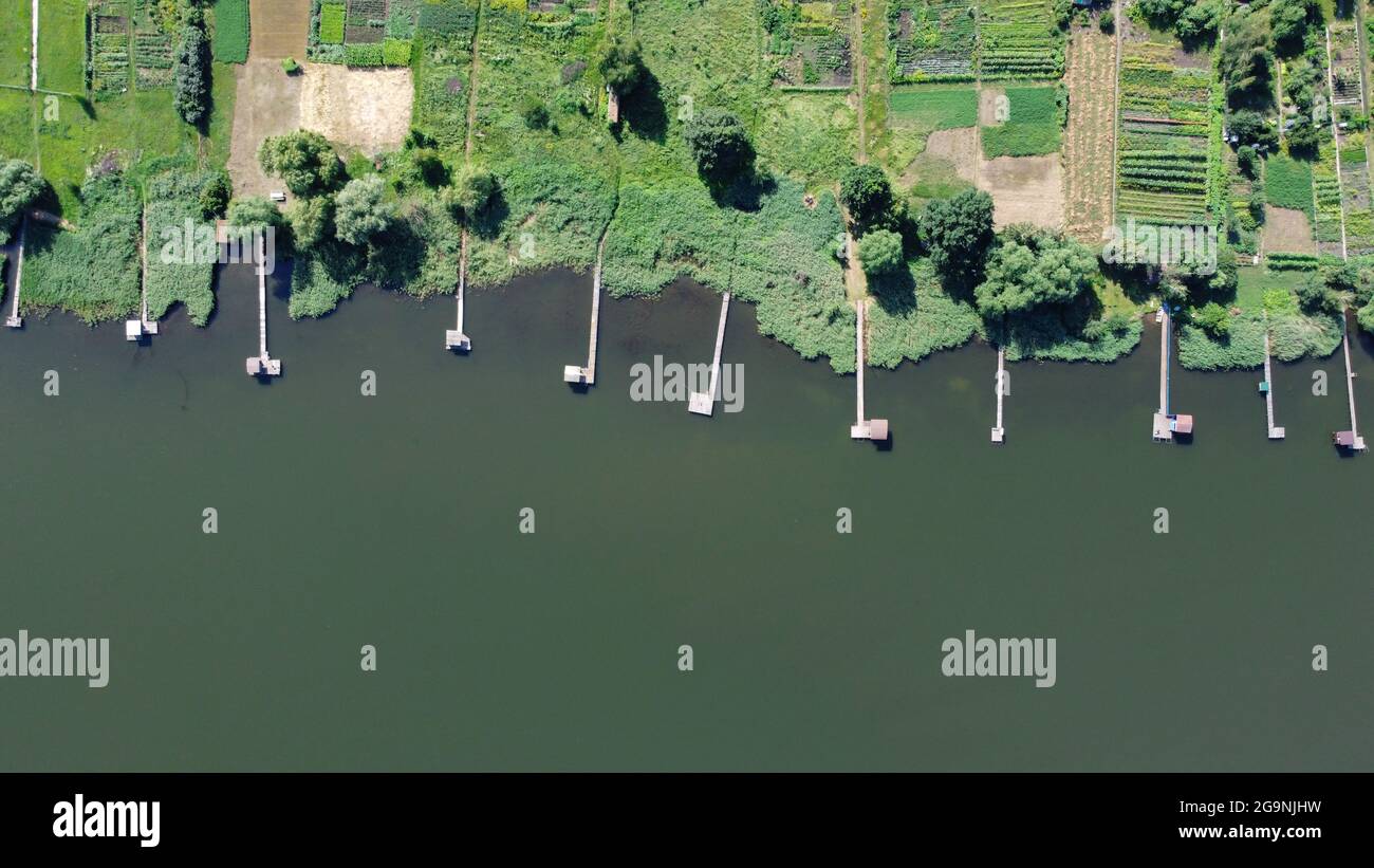 Lake pier, aerial view, photography from a drone. Fishing pier on river