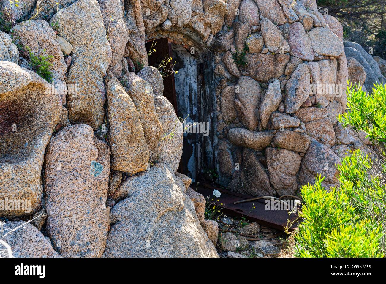 Rusting Door & Rock Camouflage Detail of Derelict Ammunition Store at the  Ruins of Batteria Battistoni, Baia Sardinia, Sardinia, italy Stock Photo -  Alamy