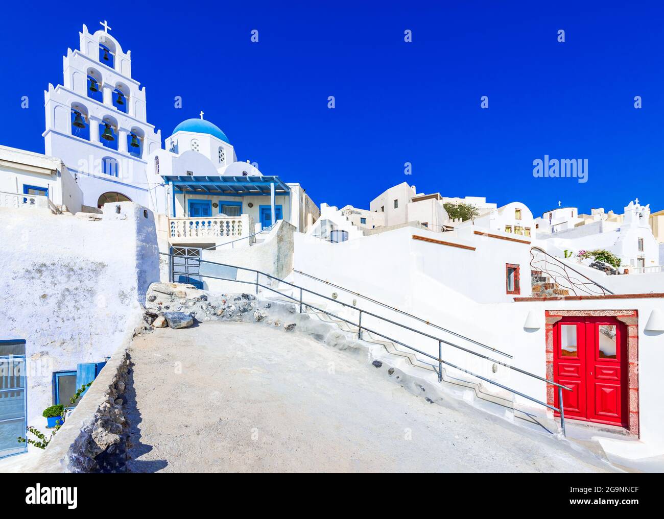 Pyrgos, Santorini, Greece. Whitewashed church on famous island of Santorini, Pyrgos small cobbled streets village, Greek Islands on Aegean Sea. Travel Stock Photo