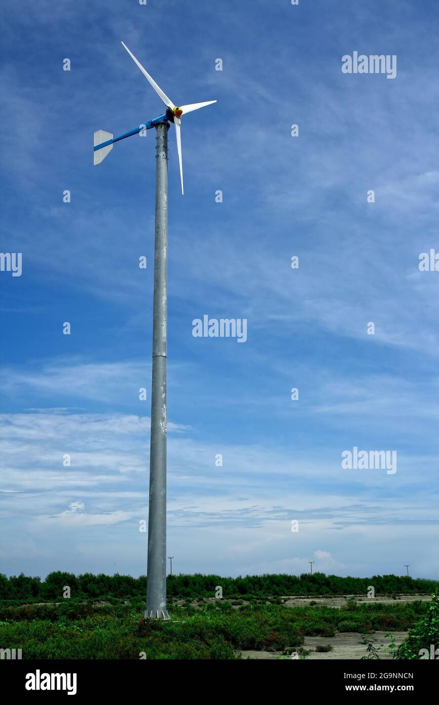 Wind turbine and blue sky Stock Photo - Alamy