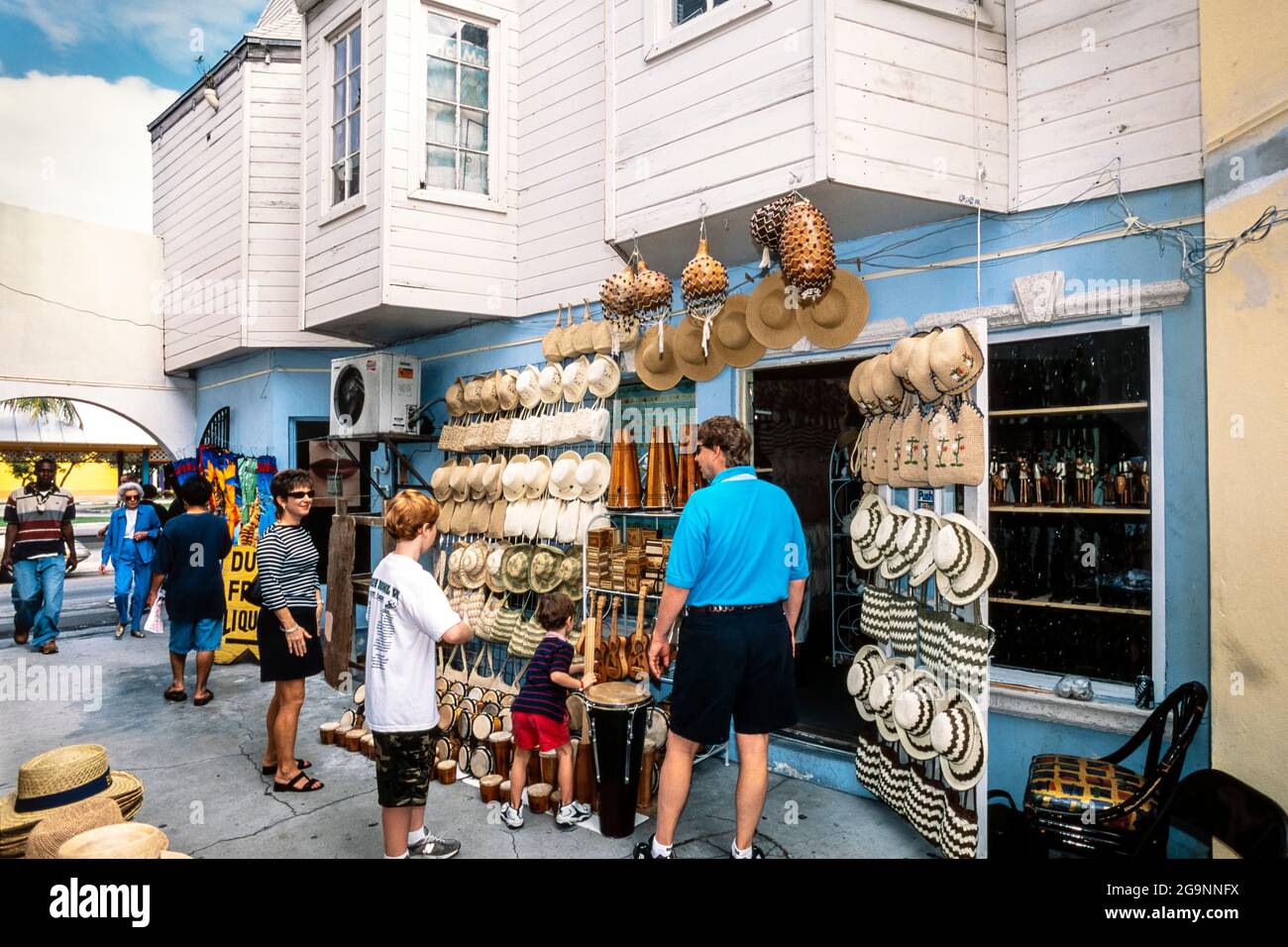Tourists shopping for souvenirs in the street, Nassau, New Providence Island, Bahamas Stock Photo