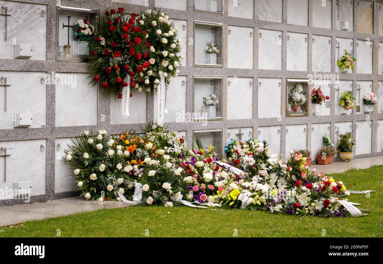 Flowers on the grave of a son who died to Covid 19 in 2021 in Spain Stock Photo