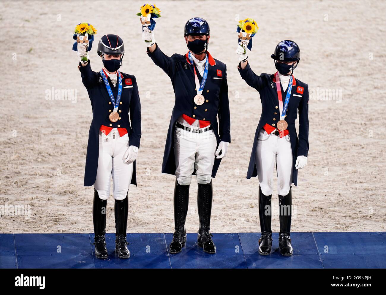 Great Britain’s Carl Hester (centre), Charlotte Fry (right) and