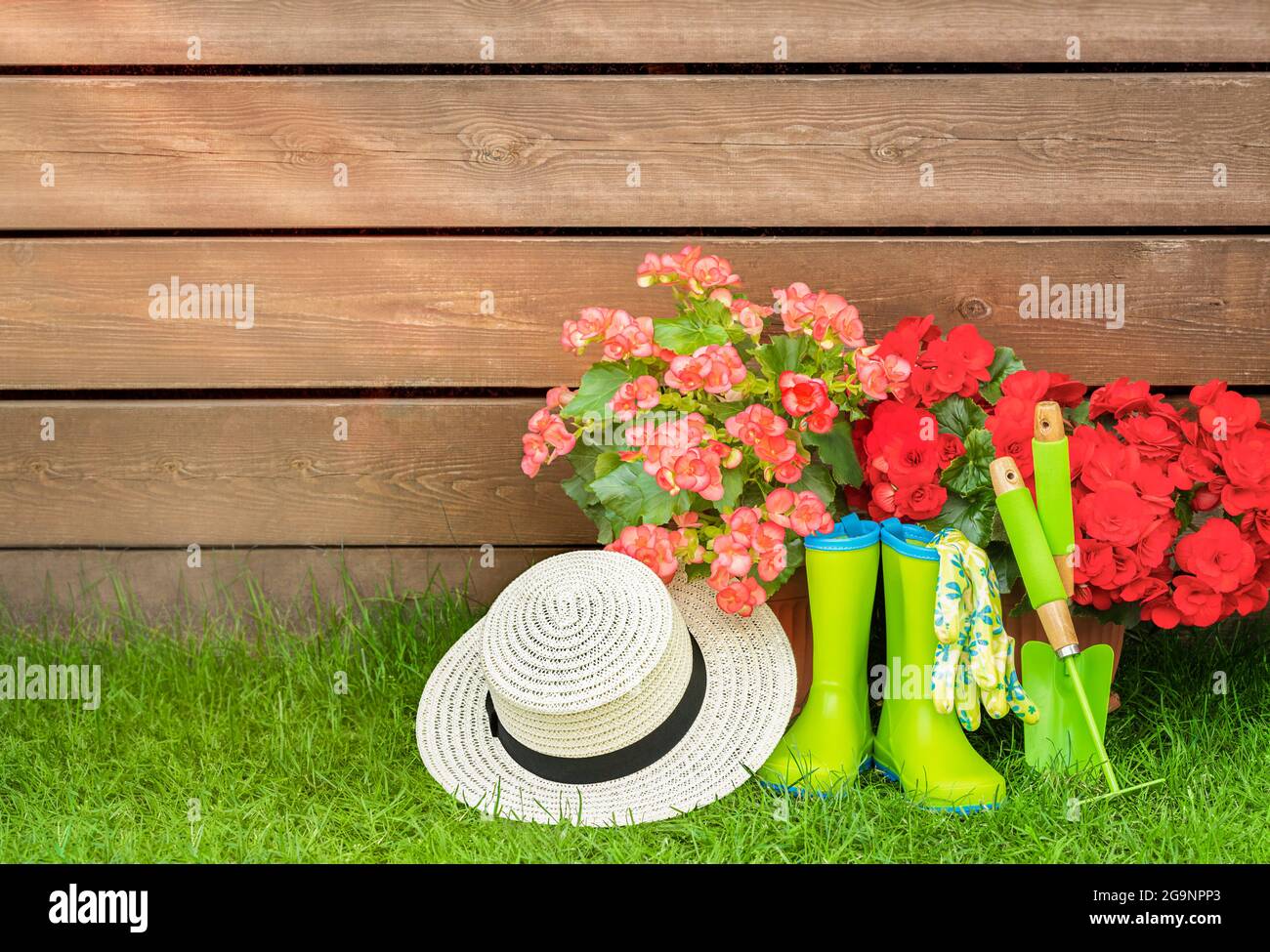 Wooden background with garden tools and a hat. Free space for your design Stock Photo