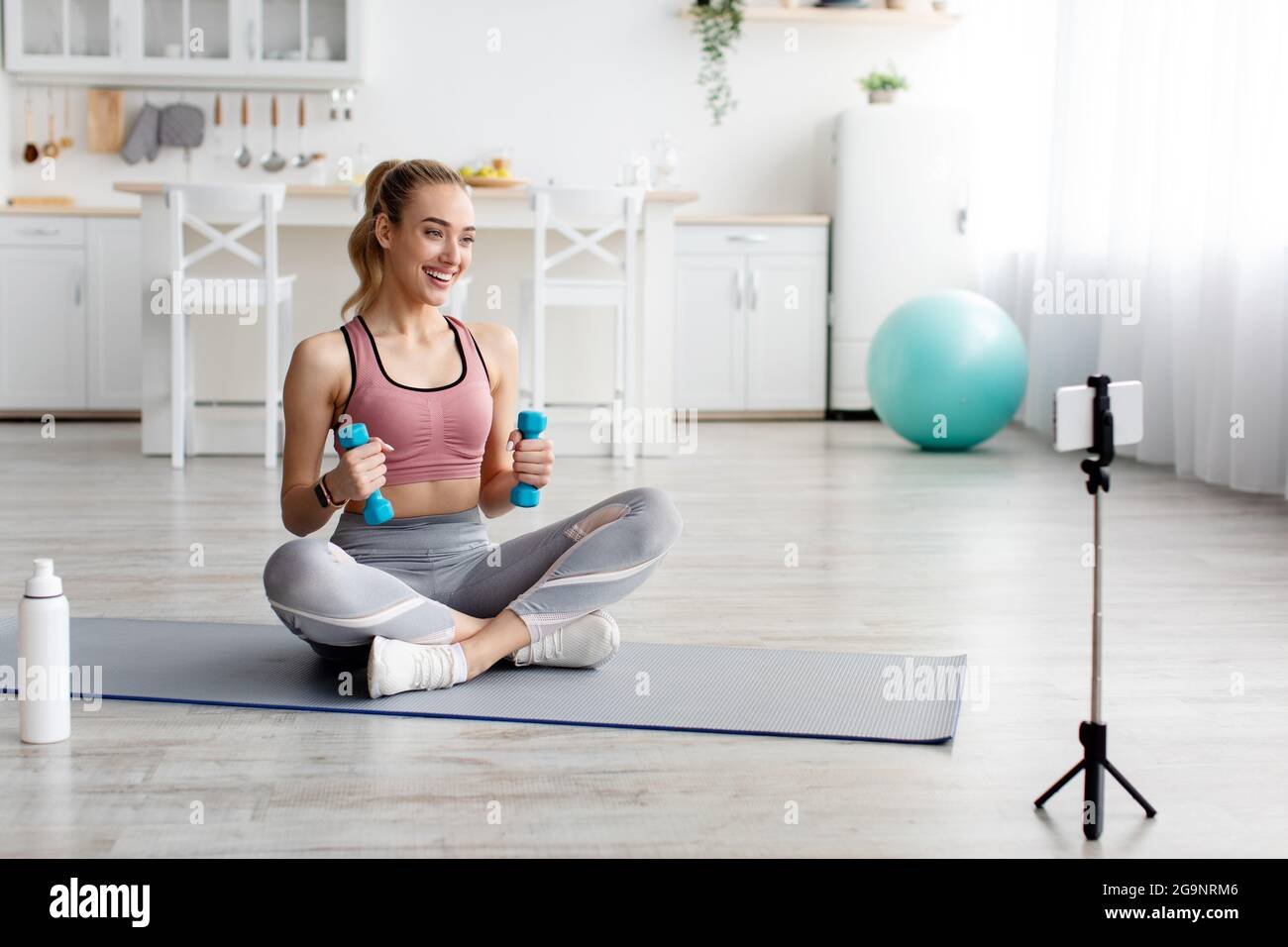 Fit blogger makes workout video for class, online lesson and modern tech Stock Photo