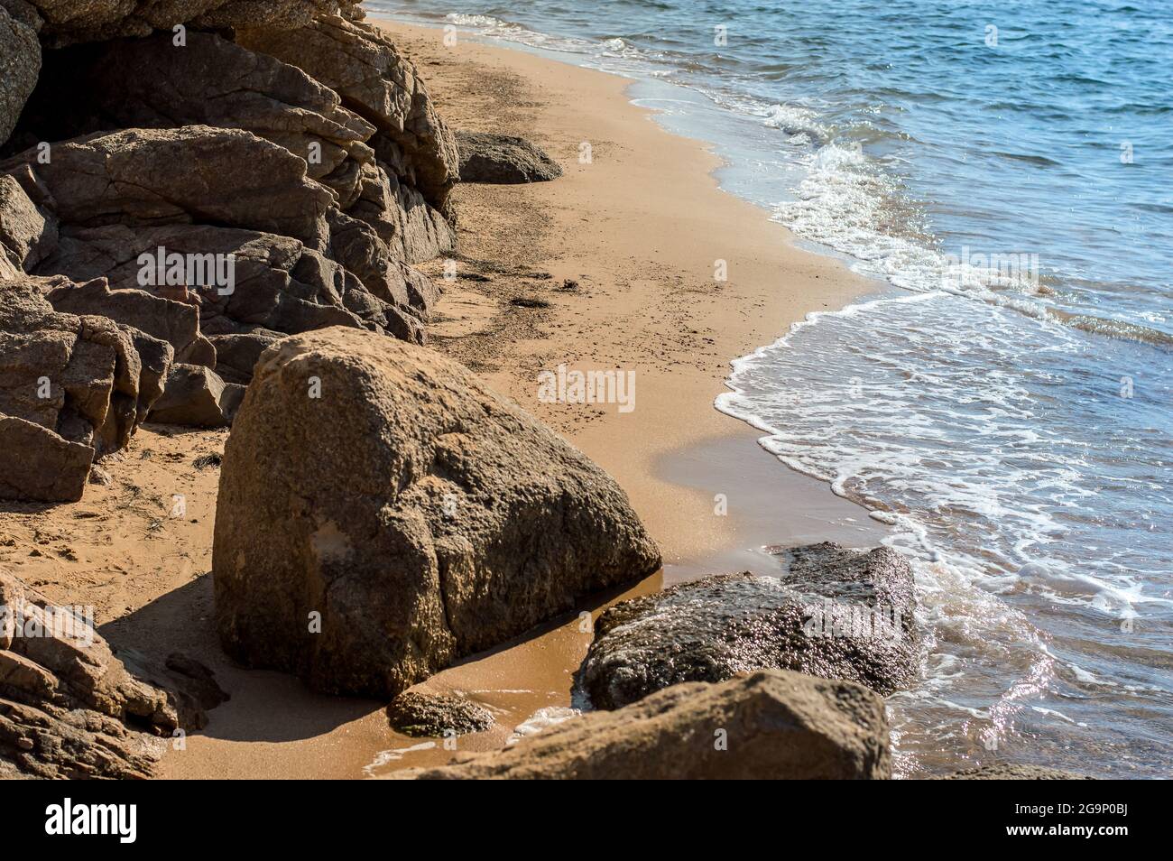Deserted beaches with rocks and yellow sand.beautiful sea.Sardinia Stock Photo