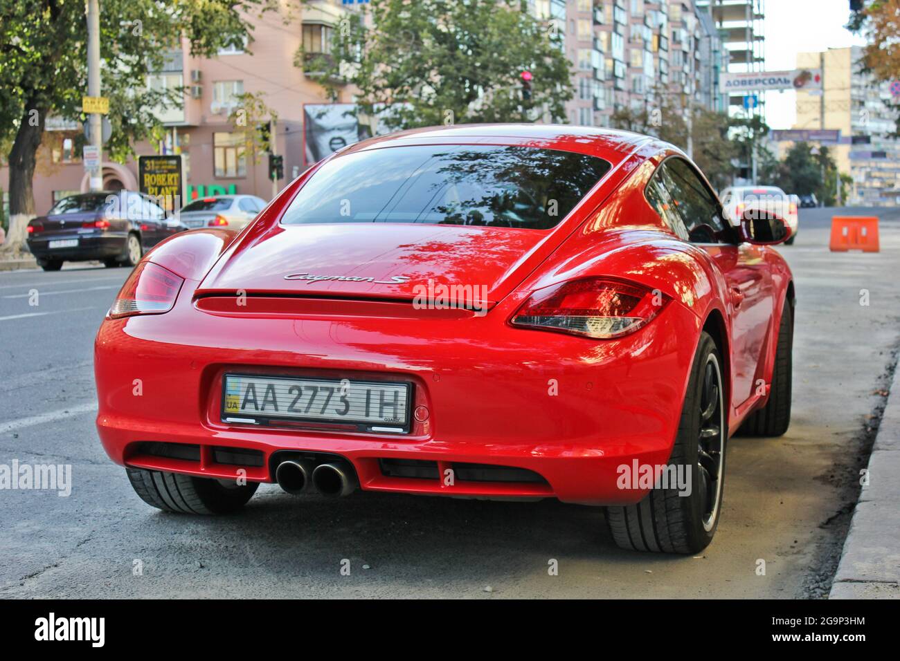 Kiev, Ukraine - July 3, 2013: Red Porsche Cayman S parked in the city Stock Photo