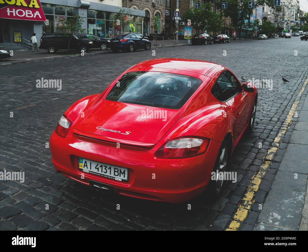 Kiev, Ukraine - May 14, 2011: Red Porsche Cayman S in the city Stock Photo