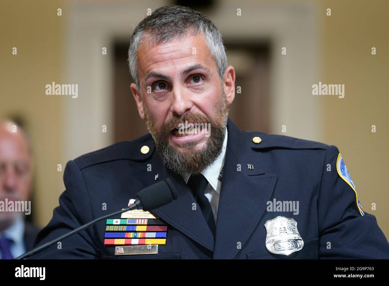 Washington Metropolitan Police Department officer Michael Fanone bangs