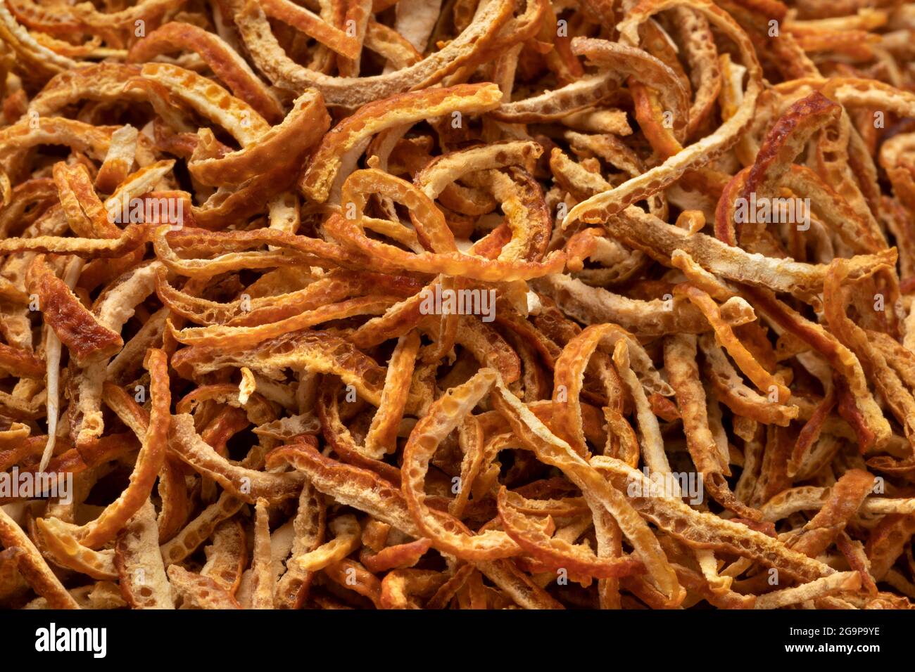 Preserved bitter orange peel close up isolated on white background