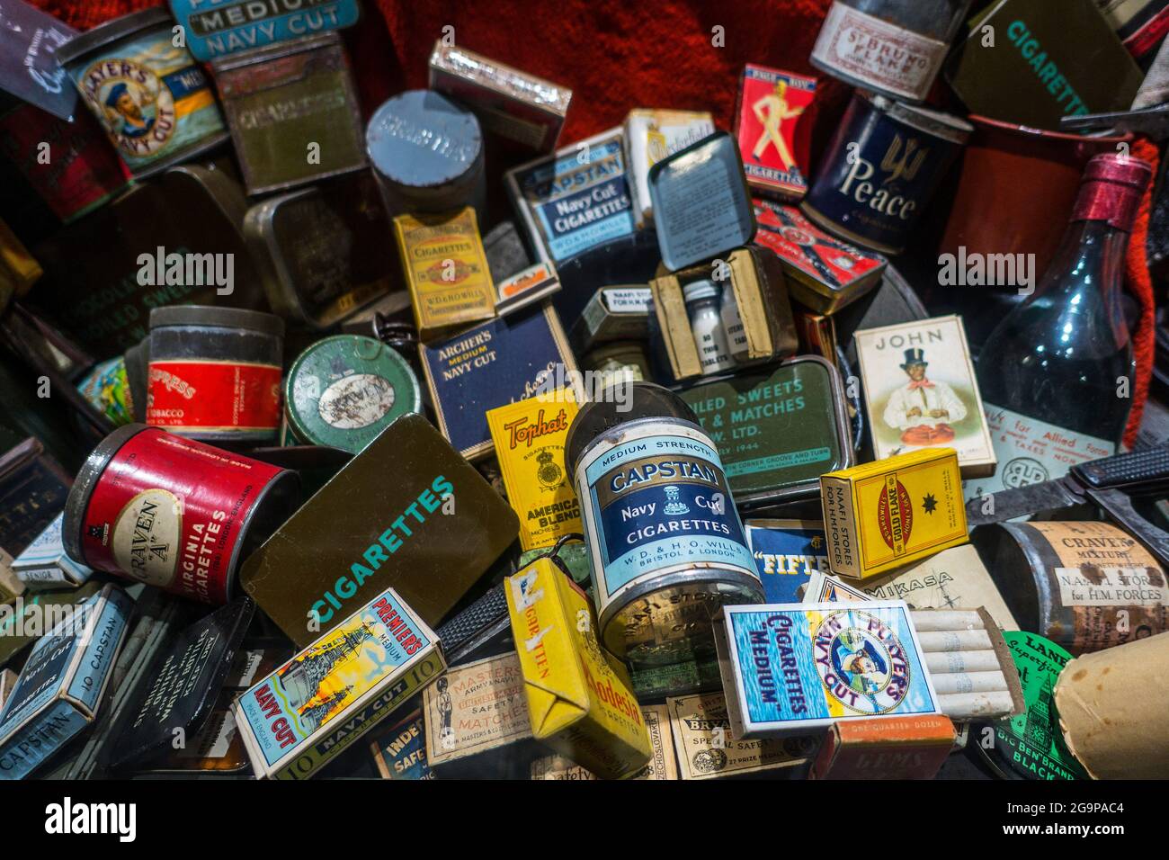 Collection of WW2 British boxes and cans with cigarettes, tobacco and matches distributed to allied soldiers during World War Two Stock Photo