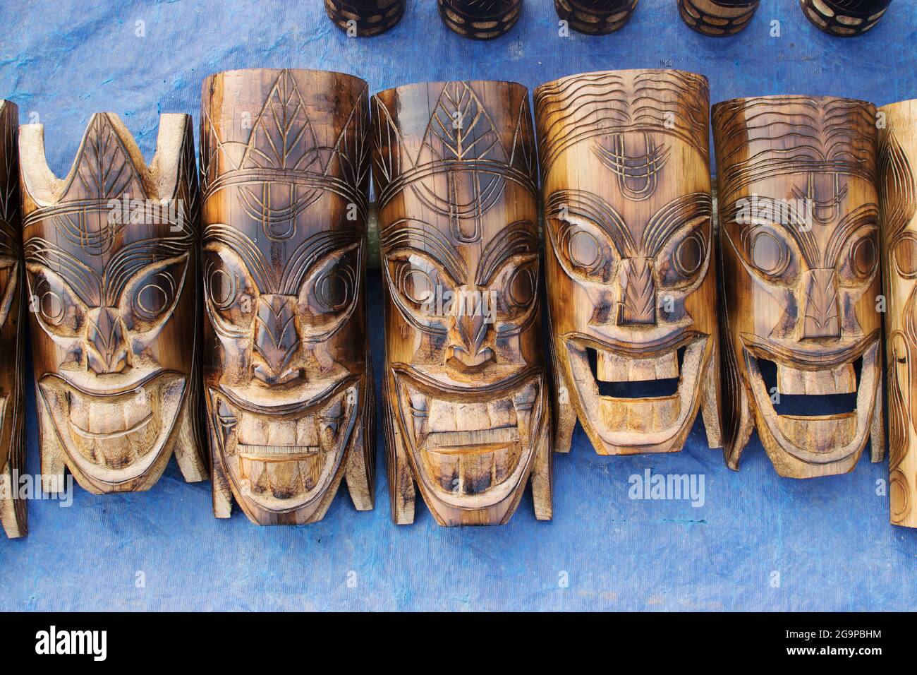 KOLKATA, WEST BENGAL , INDIA - NOVEMBER 23RD 2014 : Wooden masks of handicraft, on display during the Handicraft Fair in Kolkata. Stock Photo