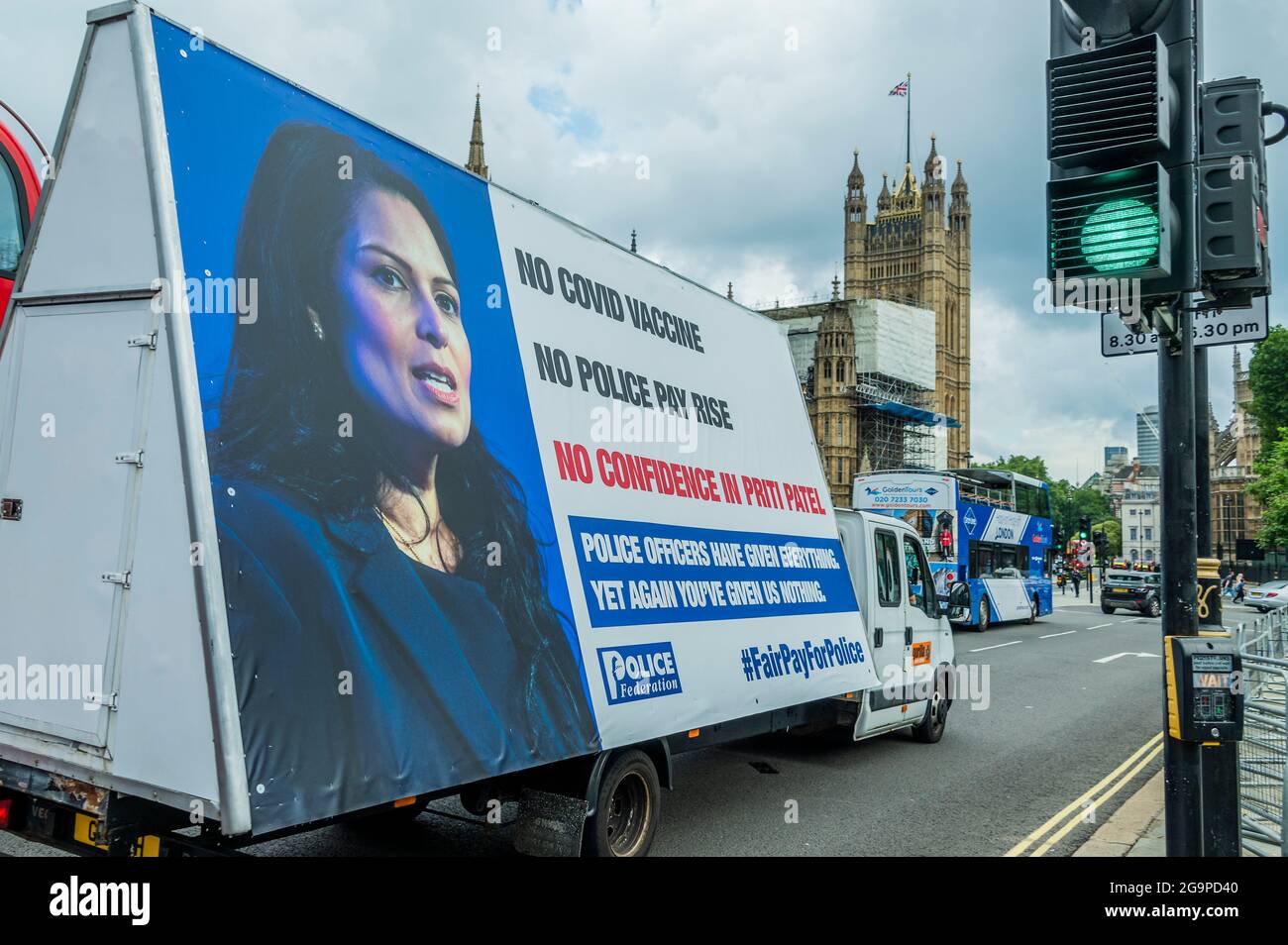 London, UK. 27th July, 2021. Outside the Home Office - Police protest over pay and lack of confidence in Priti Patel in Westminster. They claim they got no advance access to the Covid Vaccine and that they have had no pay rise. An ad van drives around westminster with their slogan - 'Police officers have given Everything. Yet again you've given us nothing' #fairpayforpolice. Credit: Guy Bell/Alamy Live News Stock Photo