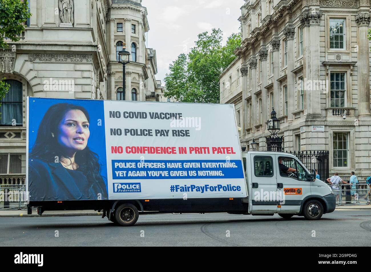 London, UK. 27th July, 2021. Outside the Home Office - Police protest over pay and lack of confidence in Priti Patel in Westminster. They claim they got no advance access to the Covid Vaccine and that they have had no pay rise. An ad van drives around westminster with their slogan - 'Police officers have given Everything. Yet again you've given us nothing' #fairpayforpolice. Credit: Guy Bell/Alamy Live News Stock Photo